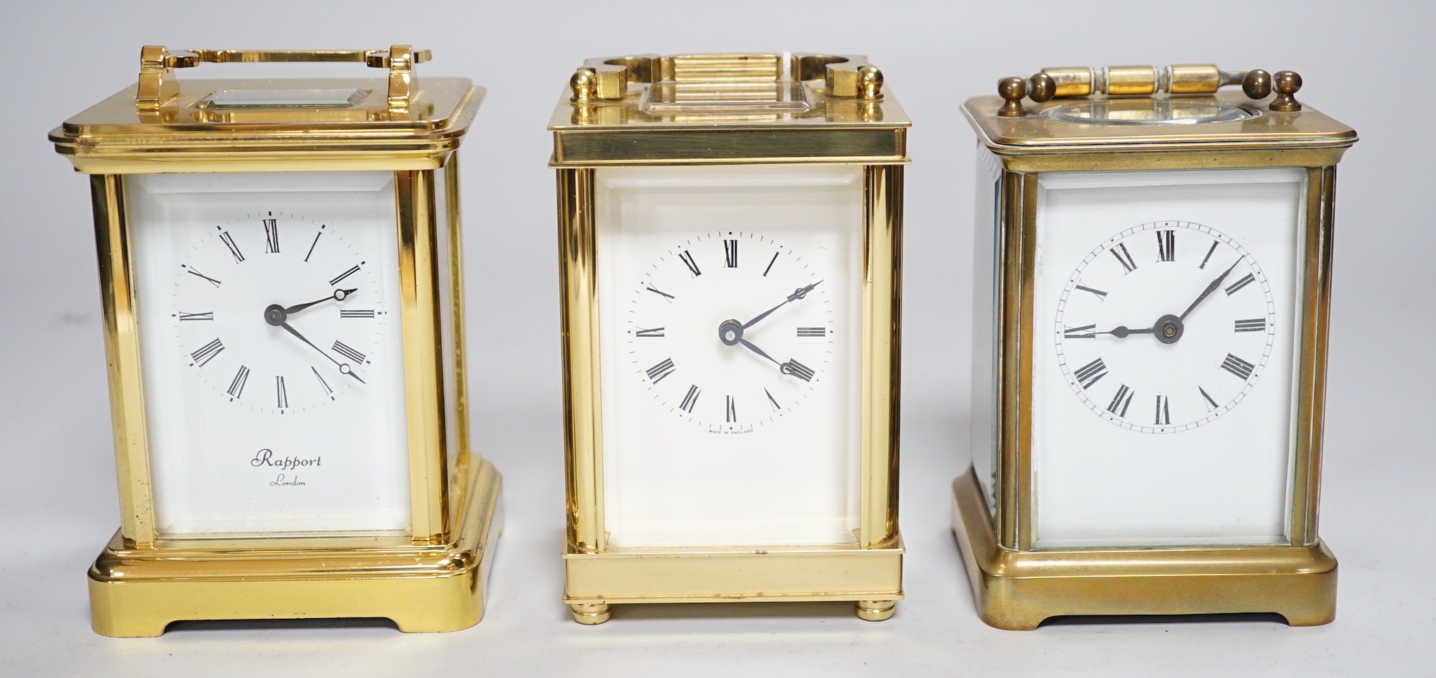 Two brass cased carriage timepieces and a brass cased carriage clock, tallest 11.5cms high